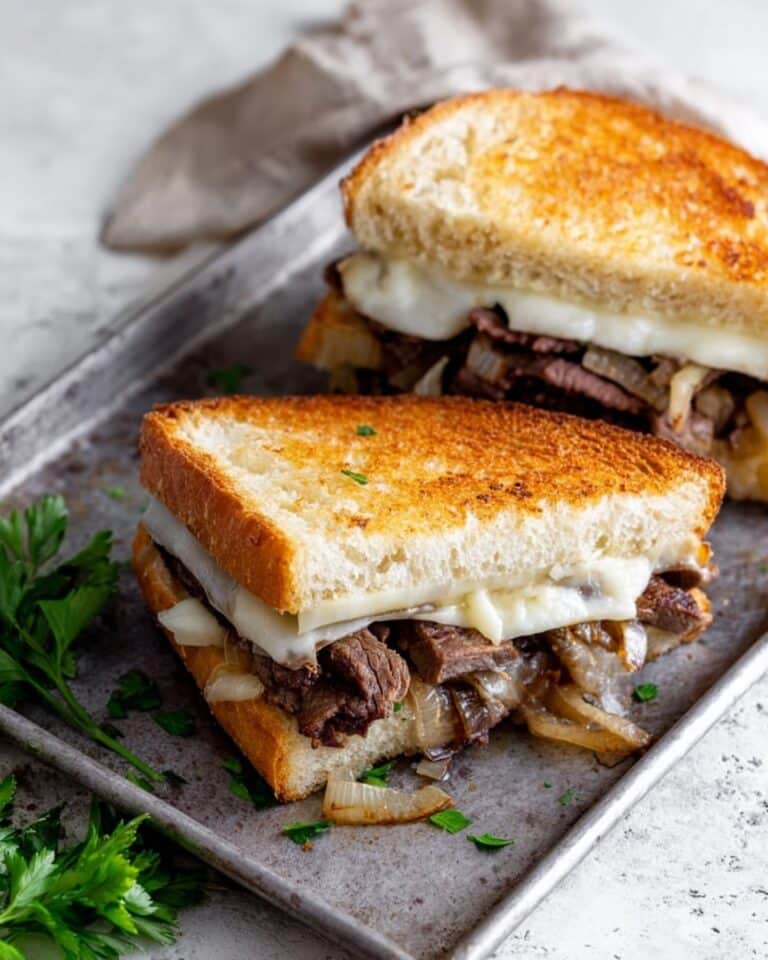 Herb Butter Steak Sandwich with Caramelized Onions and Havarti Recipe