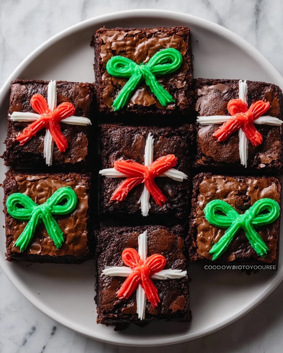 The image shows nine square chocolate brownies arranged in a 3x3 grid on a white plate, sitting on a white marbled surface. Each brownie has a shiny, cracked dark brown top. Four brownies are decorated with bright green icing shaped like a bow tied with two loops and two tails crossing in the middle. Three brownies have red icing bows with the same shape, while two brownies have white icing ribbons crossing vertically and horizontally, topped with a red bow in the center. The brownies look moist and dense, with sharp clean edges. photo taken with an iphone --ar 4:5 --v 7