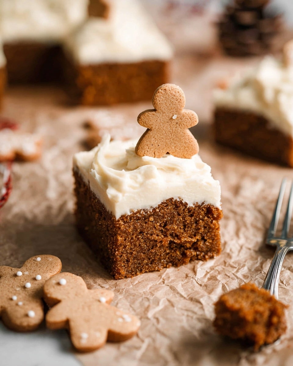 A square slice of brown gingerbread cake with a soft, crumbly texture forms the base layer, topped generously with a thick, creamy white frosting that has a smooth and slightly swirled texture. A small gingerbread cookie shaped like a person is standing upright gently pressed into the frosting on top. The cake slice is placed on crumpled beige parchment paper over a white marbled surface. Around the cake piece, there are whole gingerbread cookies, and a fork with a bite-sized piece of cake rests nearby. The background is softly blurred to focus on the cake. photo taken with an iphone --ar 4:5 --v 7