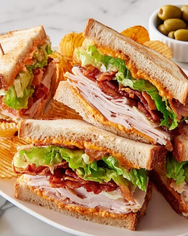 Club Sandwich with Bacon, Turkey, Ham, and Cheddar Recipe