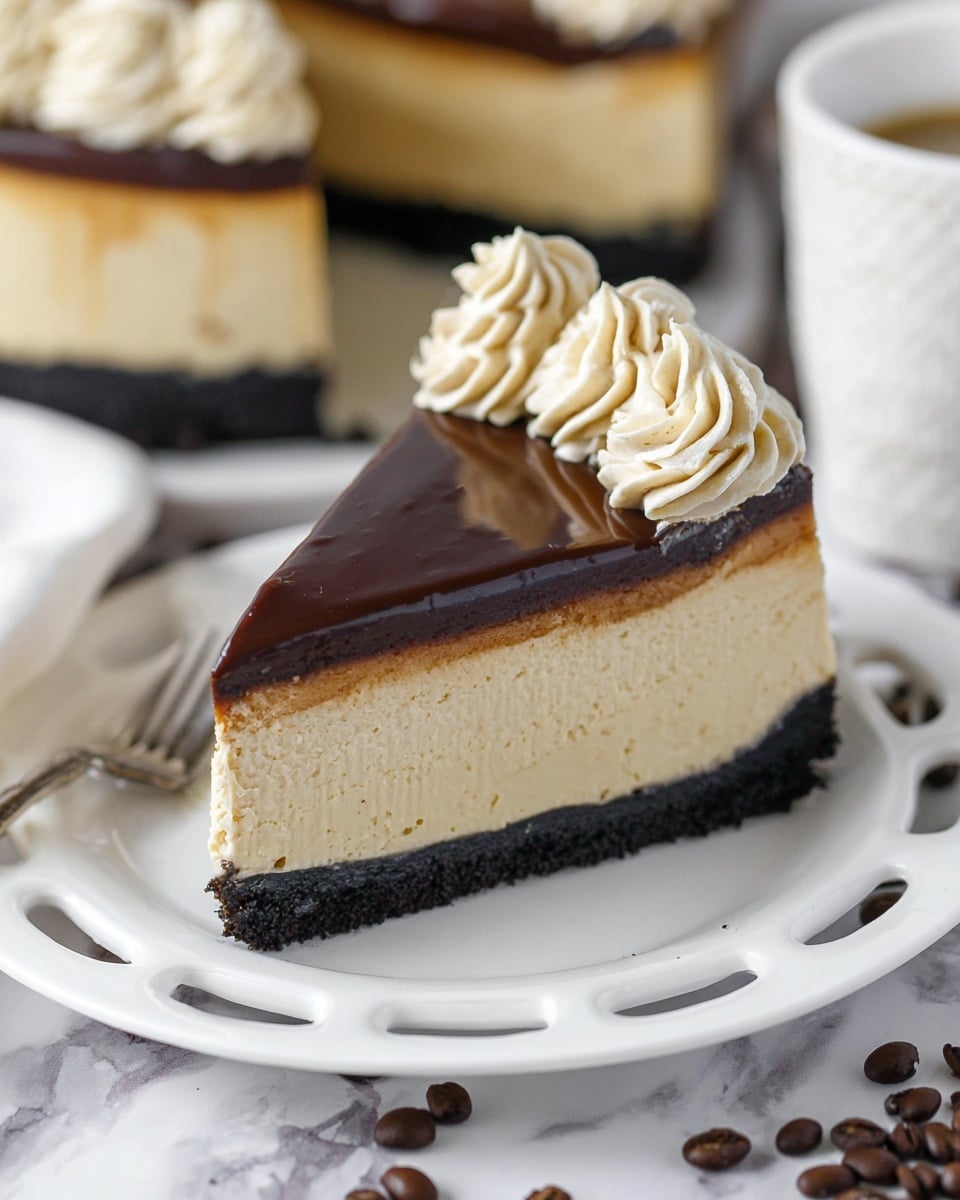 The image shows a three-layer dessert on a white plate with a scalloped edge, set on a white marbled surface. The bottom layer is a dark chocolate crumb crust, rough in texture. The middle layer is thick, light brown, and smooth, resembling a mousse or cheesecake. The top layer is a glossy, dark chocolate ganache with fine horizontal lines across it. Around the edge of the cake, there is a decorative ring of light beige whipped cream dollops, evenly spaced and swirled. A slice is cut out, revealing the clean layers inside. Coffee beans are scattered near the plate. Photo taken with an iphone --ar 4:5 --v 7