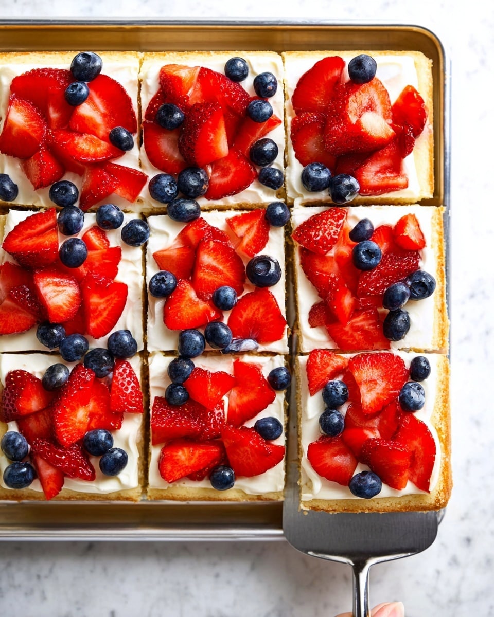 A rectangular dessert bar cut into nine square pieces, each piece showing three layers: a golden brown crust as the bottom layer with a slightly crumbly texture, a smooth white creamy layer in the middle, and a top layer covered with bright red strawberry slices and dark blue blueberries scattered unevenly. The dessert rests on a silver tray with a woman's hand holding a spatula lifting the top left piece. The whole setup is placed on a white marbled surface. photo taken with an iphone --ar 4:5 --v 7