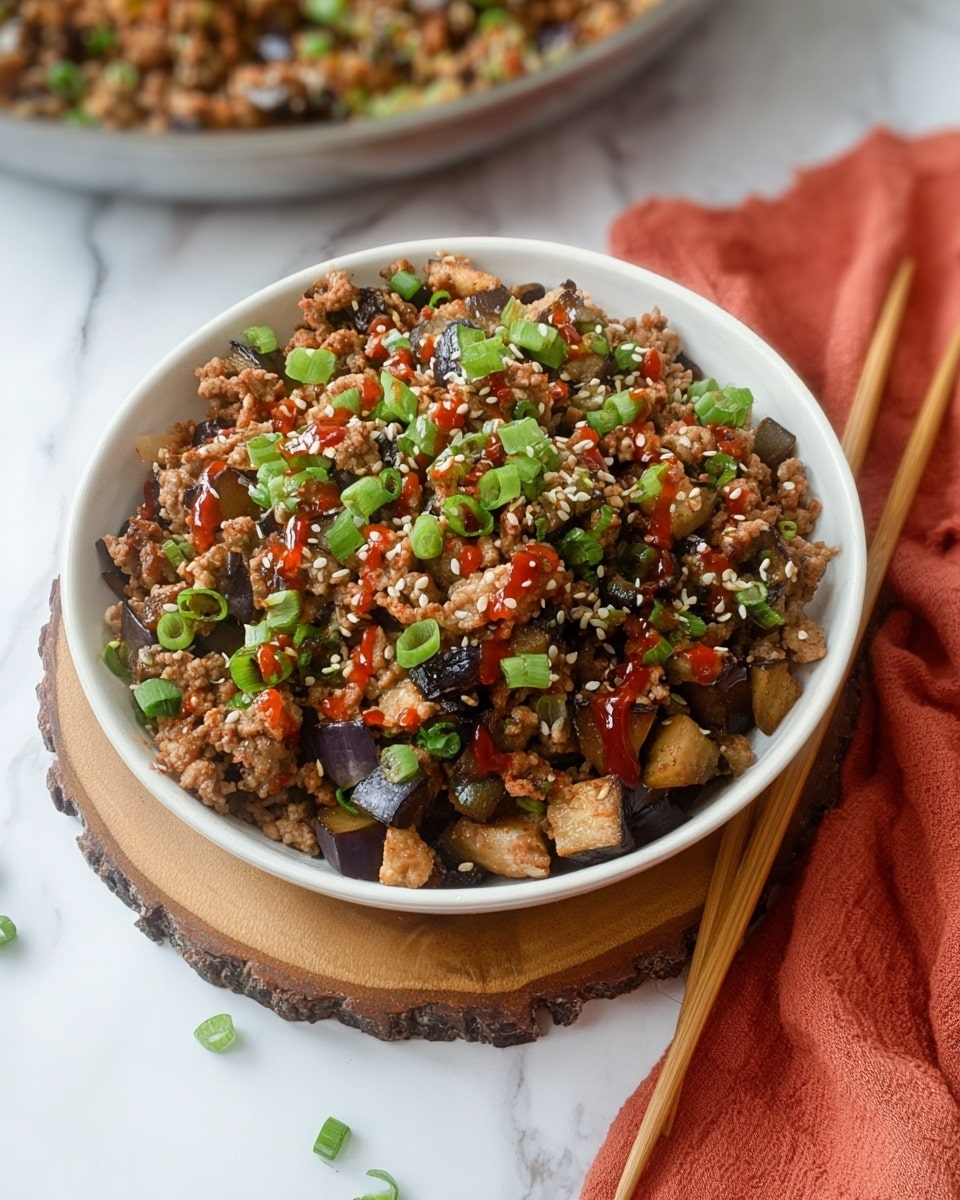 A round beige pan filled with cooked ground meat mixed with small pieces of vegetables, including chopped onions, purple cabbage, carrot strips, and green herbs, all intermixed in a slightly oily texture. The mixture shows varied brown, light beige, orange, green, and purple colors, with the vegetables appearing soft and slightly sautéed. The pan handle points downward and rests on a white marbled surface. photo taken with an iphone --ar 4:5 --v 7