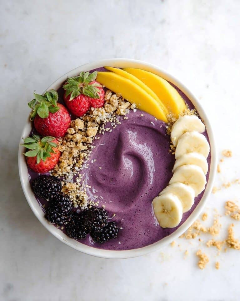 Creamy Acai Bowl with Fresh Fruit and Nut Toppings Recipe